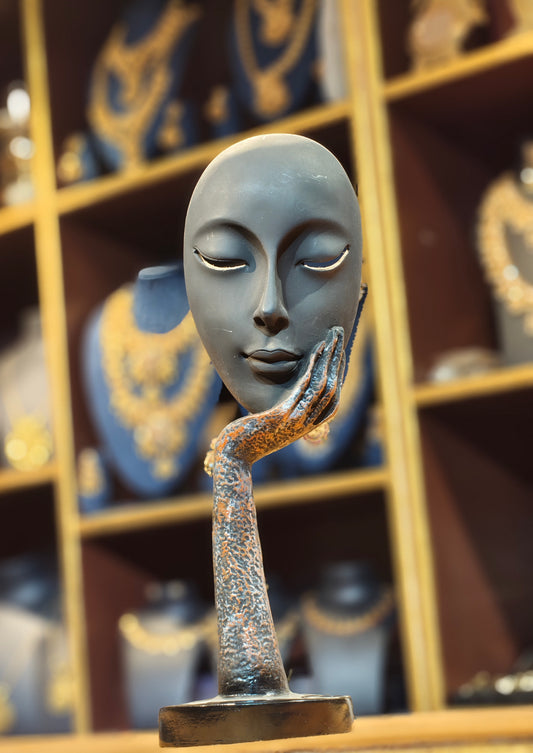 Modern Abstract Serene Face on Hand Sculpture – Matte Black & Textured Bronze Contemplation Figurine