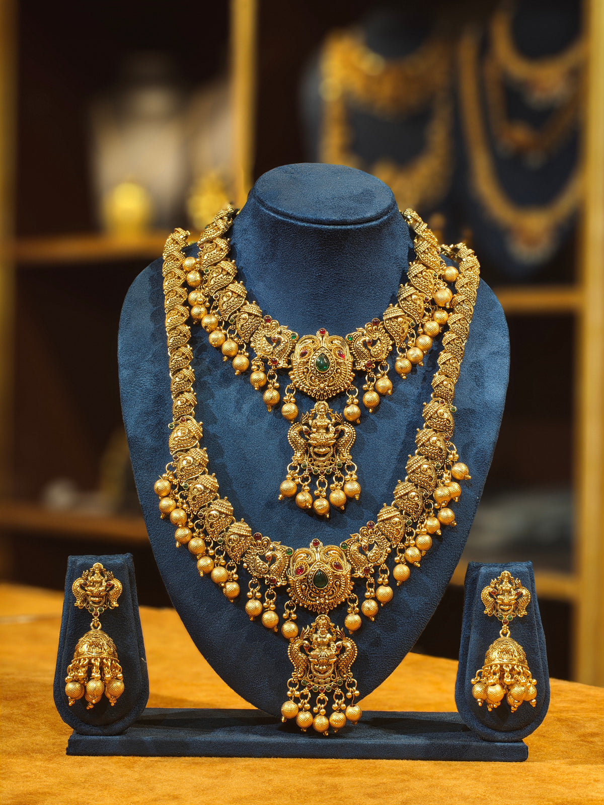 Antique Matte Gold Nakshi Temple Bridal Jewelry Set – Dual-Pendant Lakshmi Necklace, Long Haram & Heavy Bell Jhumkas