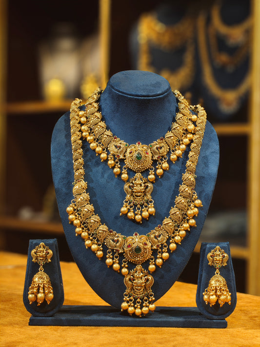 Antique Matte Gold Nakshi Temple Bridal Jewelry Set – Dual-Pendant Lakshmi Necklace, Long Haram & Heavy Bell Jhumkas